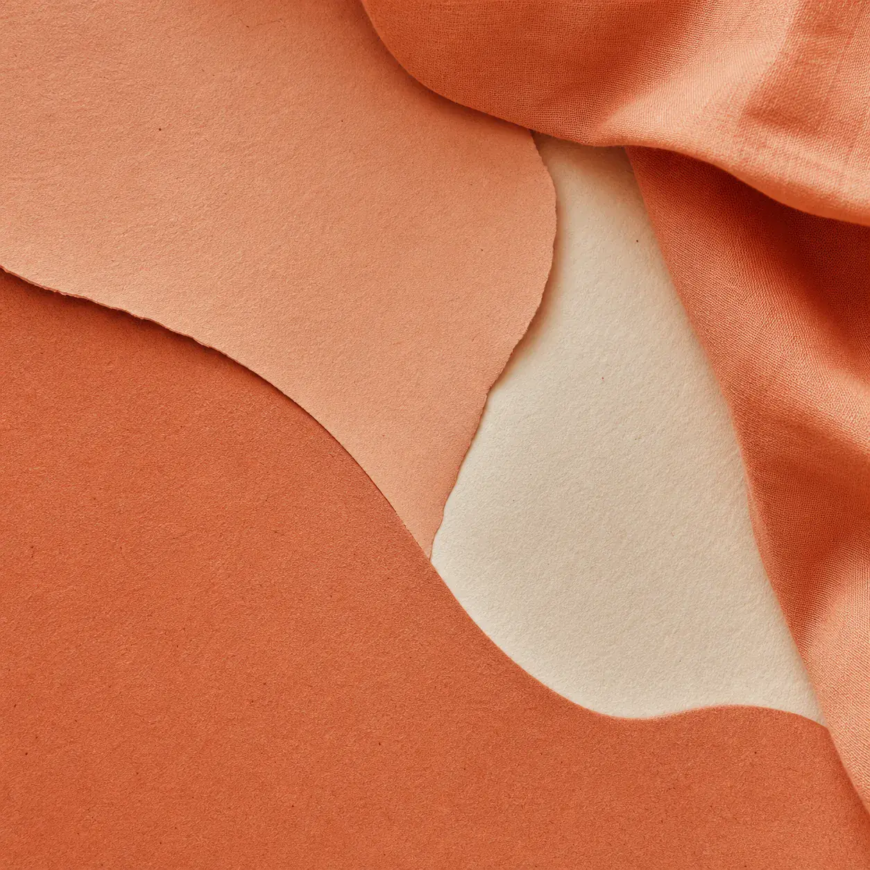 Muted terracotta paper and textile texture